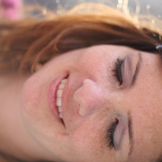 Freckled Beauty Smiling Softly in Natural Light