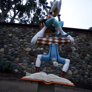Whimsical Acrobatic Book Sculpture at Dusk