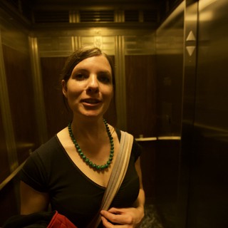 Woman in Elevator During Late Night Art Walk