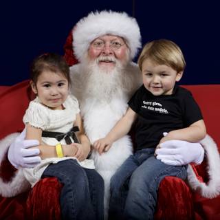 Santa Claus Spends Time with Two Adorable Kids
