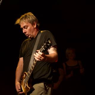 Brian Baker Rocks the Stage with his Electric Guitar at 2007 Bad Religion Glasshouse Concert
