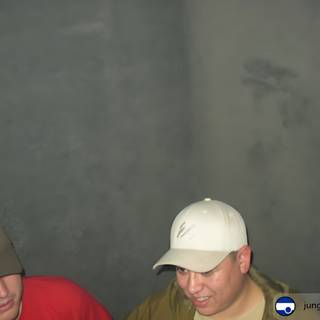 Two Men in Hats Surrounded by Smoke