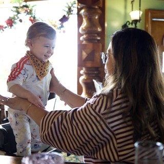 Joyful Moment Between Mother and Toddler in Festive Home