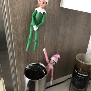 Elf Dolls Hang by the Counter