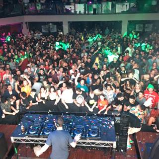 Nightclub Crowd Excited for DJ Performance