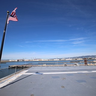 American Flag Flying Over USS Hornet Flight Deck