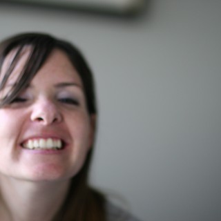 Laughing Young Woman with Eyes Closed in Joy