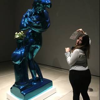 The Woman and the Blue Sculpture