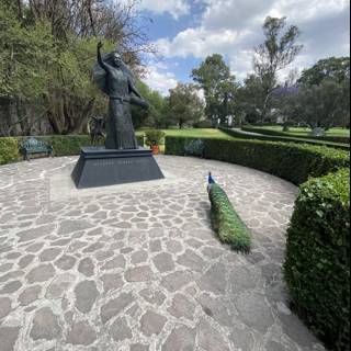 Man and Peacock Statue in Xochimilco Park
