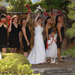 Joyful Bridal Party Celebrates at Garden Waterfall