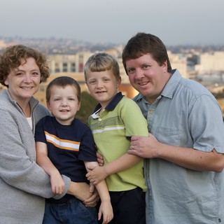 Family Portrait on Urban Rooftop at Dusk