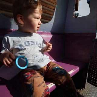Young Child on Amusement Park Ride at Fantasyland