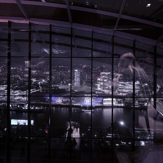 Ghostly Figure in London Skyline Observatory at Night