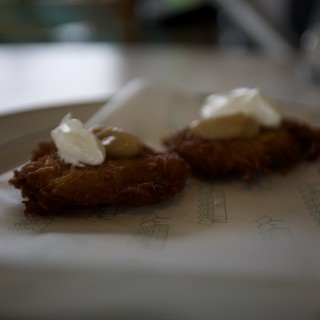 Crispy Fried Delicacy with Cream Garnish at Ashes and Diamonds