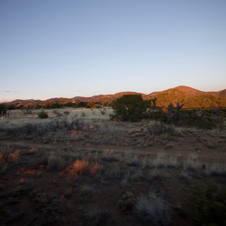 Desert Twilight Over Scrubland Hills and Mountains