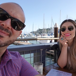 Couple Enjoying Waterfront Dining at Marina