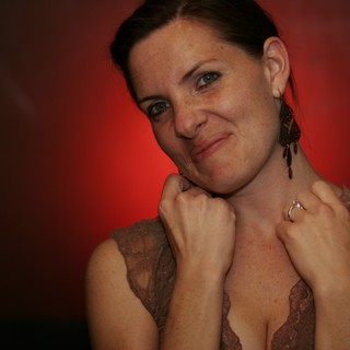 Playful Portrait of Penelope Against Red Background