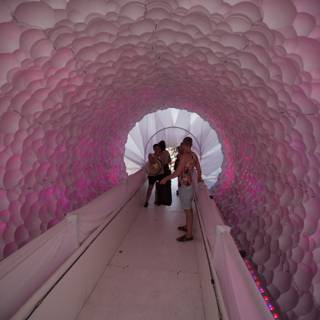 Walking Through a Tunnel of Pink Balloons