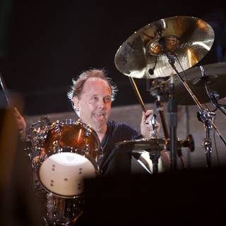 Lars Ulrich lights up the stage with his drumming skills