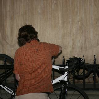 Man admires sleek bicycle during downtown art ride