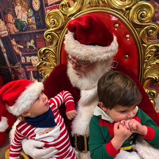 Children Meeting Santa Claus in His Ornate Throne