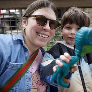 Mother and Son's Joyful Day with Dinosaur Toy