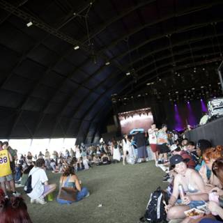 Coachella Vibes: Casual Moments Under the Stage Tent