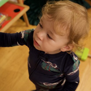 Toddler Pointing with Delight on Christmas Morning