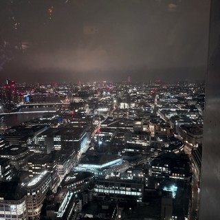 London Cityscape at Night with Fireworks Display