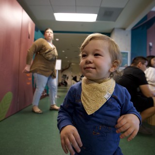Joyful Toddler in Blue at Daycare Center
