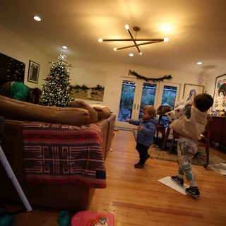 Children Playing in Cozy Living Room on Christmas Evening
