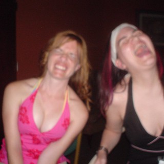 Two Women Laughing Joyfully at a Nightclub