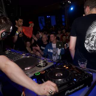 DJ pumps up the crowd at a nightclub