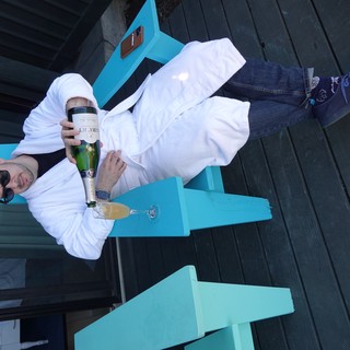 Relaxing with Champagne in White Robe