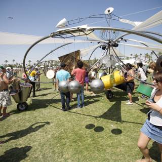 A Group Gathering Around A Metal Structure at Coachella