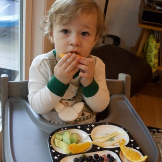 Toddler Enjoying a Healthy Snack at Home