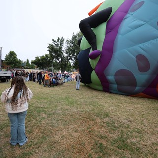 Giant Character Balloon Being Inflated at Festival