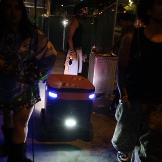 Autonomous Delivery Robot Navigates Night Festival Crowd