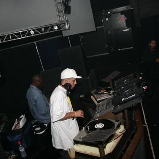 Dj S Playing a Set in a White Hat