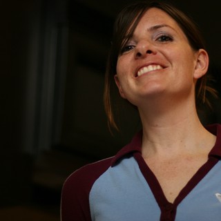 Joyful Woman Smiling Upward in Warm Light