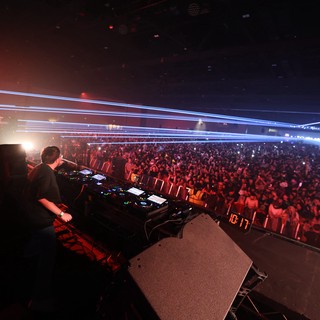 DJ Ignites Massive Crowd with Laser Light Show