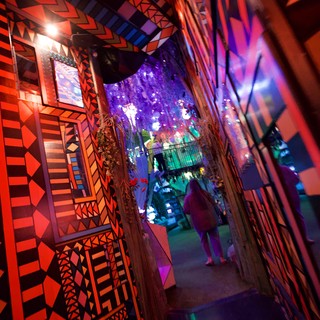 Vibrant Geometric Corridor with Illuminated Art Installation