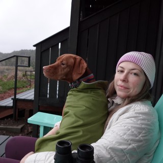 Woman and Dog Relaxing on Modern Deck