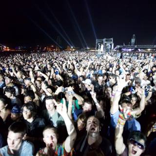 Hands Up in the Night Sky: A Concert Crowd Comes Alive