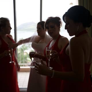 Red-Dressed Bridesmaids Toast to the Bride