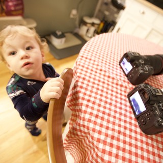 Curious Toddler Helper in Kitchen During Christmas Morning