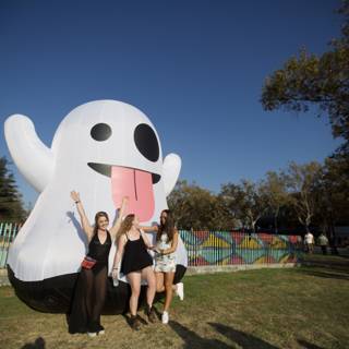 Giant Inflatable Ghost Poses with Three Women