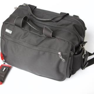 Sleek Black Backpack with Red Tag