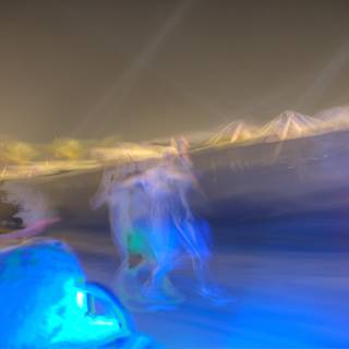 Blurry Snowboarders in the Moonlight