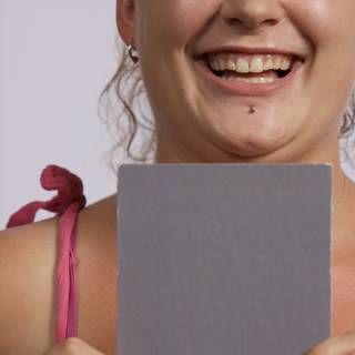 Grinning Girl with Paper